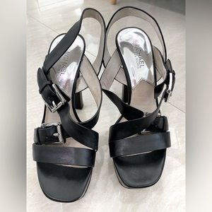 Michael Kors shoes. Black leather platform sandal. High heels. Good condition